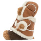 Side view of a Jellycat Bartholomew Bear ‘Alpine’ wearing a hooded, shearling-trimmed winter coat.