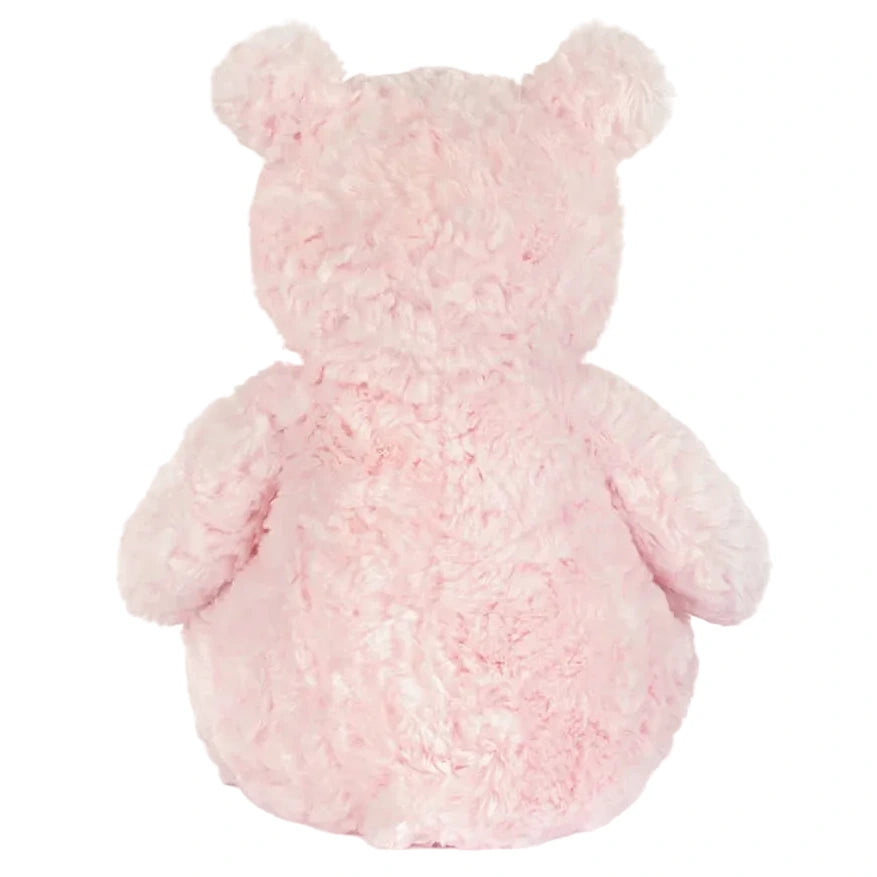 The Jellycat Leola Bear Medium is a fluffy pink artist bear, shown from the back with its head, ears, arms, and body visible against a white background—crafted with care in a South London studio.