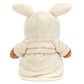 The Jellycat Bartholomew Bear Bathrobe is a stuffed bear dressed in a cream hooded robe with bunny ears, shown from the back.