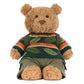 The Jellycat Bartholomew Bear Hiking Outfit features Bartholomew Bear dressed in a green, orange, and brown striped sweater with khaki shorts, sitting upright and ready for cuddles.