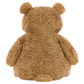 The Jellycat Bartholomew Bear, Medium, sits with its back to the camera, highlighting its cuddly fudge-colored tummy against a white background.