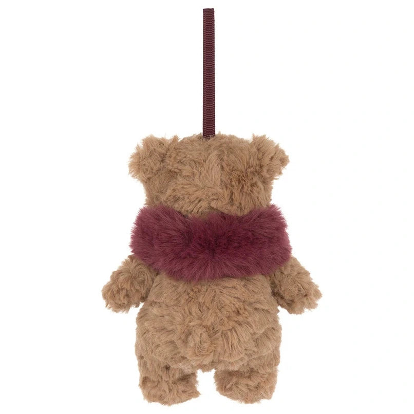 Jellycat Bartholomew Bear Winter Warmer Decoration plush ornament in a burgundy faux fur scarf, hanging by a ribbon.