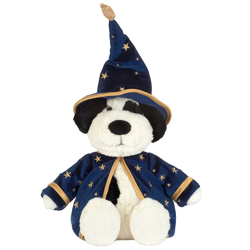 Jellycat’s Rufferty Puppy Wizard Outfit plush dog toy sits upright against a white background, dressed in a blue wizard hat and robe adorned with gold stars—a magical companion for all ages.