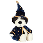 The Jellycat Rufferty Puppy Wizard Outfit plush dog toy sits upright against a white background, wearing a blue wizard hat and cape adorned with gold stars.