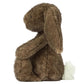 The Jellycat Hoppleston Luxe Bunny Original plush sits upright in side profile, highlighting its long floppy ears and fluffy white tail against a plain white background.