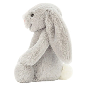 The Bashful Silver Bunny by Jellycat is a soft plush in a gentle silver shade, featuring long floppy ears, a pink nose, black eyes, and a white tail—perfect as a bedtime story companion.