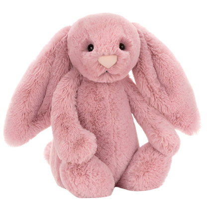 A plush Bashful Tulip Pink Bunny sits upright with long floppy ears.