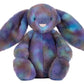 Jellycat Zodihop Luxe Bunny plush features long floppy ears and ultra-soft, multicolored cosmic-patterned fur in purple, blue, and green.