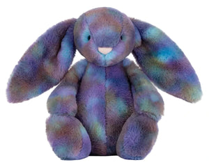 Jellycat Zodihop Luxe Bunny plush features long floppy ears and ultra-soft, multicolored cosmic-patterned fur in purple, blue, and green.