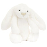 Bashful Luxe Bunny Luna, a white stuffed bunny designed by Jellycat, sitting on a white background.