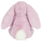 The Jellycat Thistlepop Blossom Luxe Bunny Original features plush pink fur, long floppy ears, and a white tail—an adorable bunny viewed from the back, perfect for gifting with a Rainbow Birthday Cake.