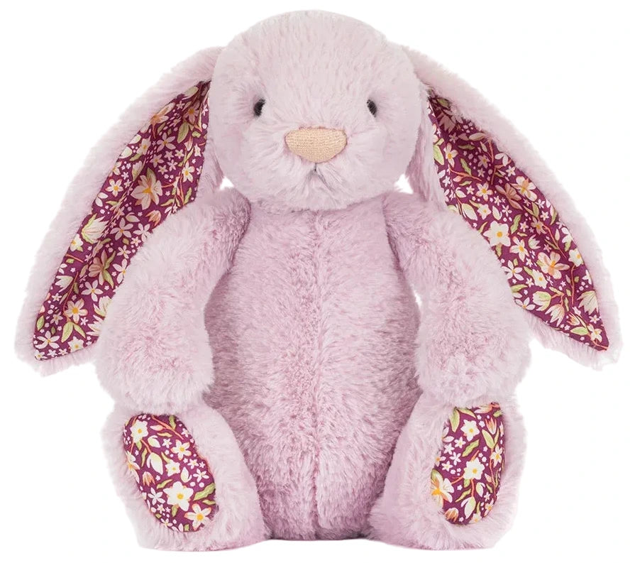 Jellycat's Thistlepop Blossom Luxe Bunny Original is a light pink plush bunny with long floral-patterned ears and matching paw pads, sitting upright against a white background. Part of the adorable Amuseable collection.