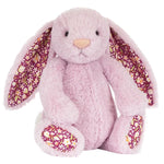 The Jellycat Thistlepop Blossom Luxe Bunny Original is a plush pink bunny with floral-patterned inner ears and feet, sitting upright—an adorable addition to any Jellycat collection.