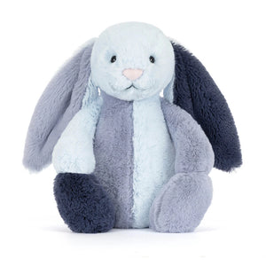 The Jellycat Puddlesea Bunny plush toy features soft light and dark blue fabric, long floppy ears, and an upright pose—ideal for cuddling or pairing with beach toys for imaginative play.