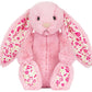 The Jellycat Blushkin Blossom Luxe Bunny Original is a pink plush bunny with long floppy ears lined in a pink floral pattern, sitting upright and facing forward.