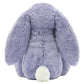 The Bashful Viola Bunny by Jellycat is a plush toy in lavender, shown from the back with long floppy ears and a round white tail.