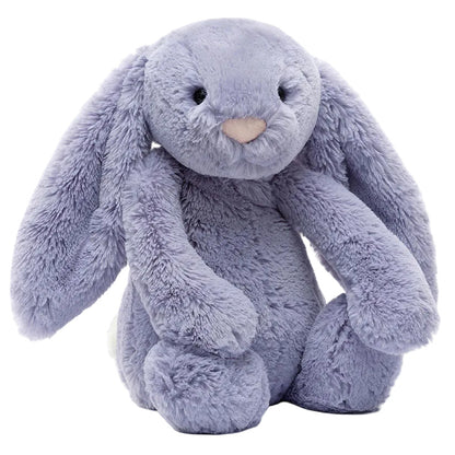 The Jellycat Bashful Viola Bunny is a grey plush toy with long floppy ears, black eyes, and a light pink nose, sitting upright against a white background.