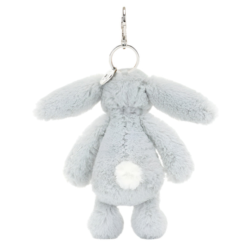 The Jellycat Bashful Silver Bunny Bag Charm is a fluffy, gray keychain with long ears and a white tail, perfect for your next adventure.