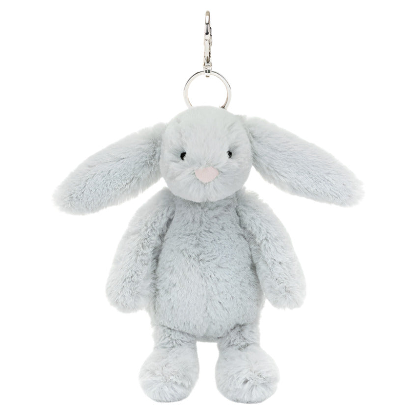 The Jellycat Bashful Silver Bunny Bag Charm is a Gray plush bunny keychain that doubles as a charming bag accessory, featuring a metal ring and clip, making it your perfect adventure companion.