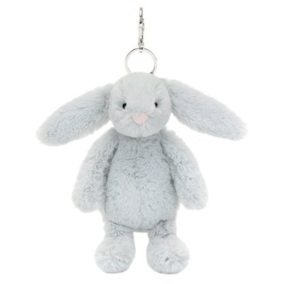 The Jellycat Bashful Silver Bunny Bag Charm is a Gray plush bunny keychain that doubles as a charming bag accessory, featuring a metal ring and clip, making it your perfect adventure companion.