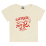 The Bonton Baby Tuba Grenadine T-Shirt is a beige, short-sleeve cotton tee featuring red text and a drink graphic with ice, straw, and lemon slice. Part of the Viva la Vida collection, it reads "Grenadine & Coups de Soleil.