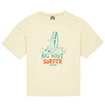 The Boys' Big Wave Livo T-Shirt by Bonton is a pale yellow kids’ summer tee with a cartoon dog and surfboard plus “Big Wave Surfer Bonbon” in green and orange—perfect for playful summer fun.