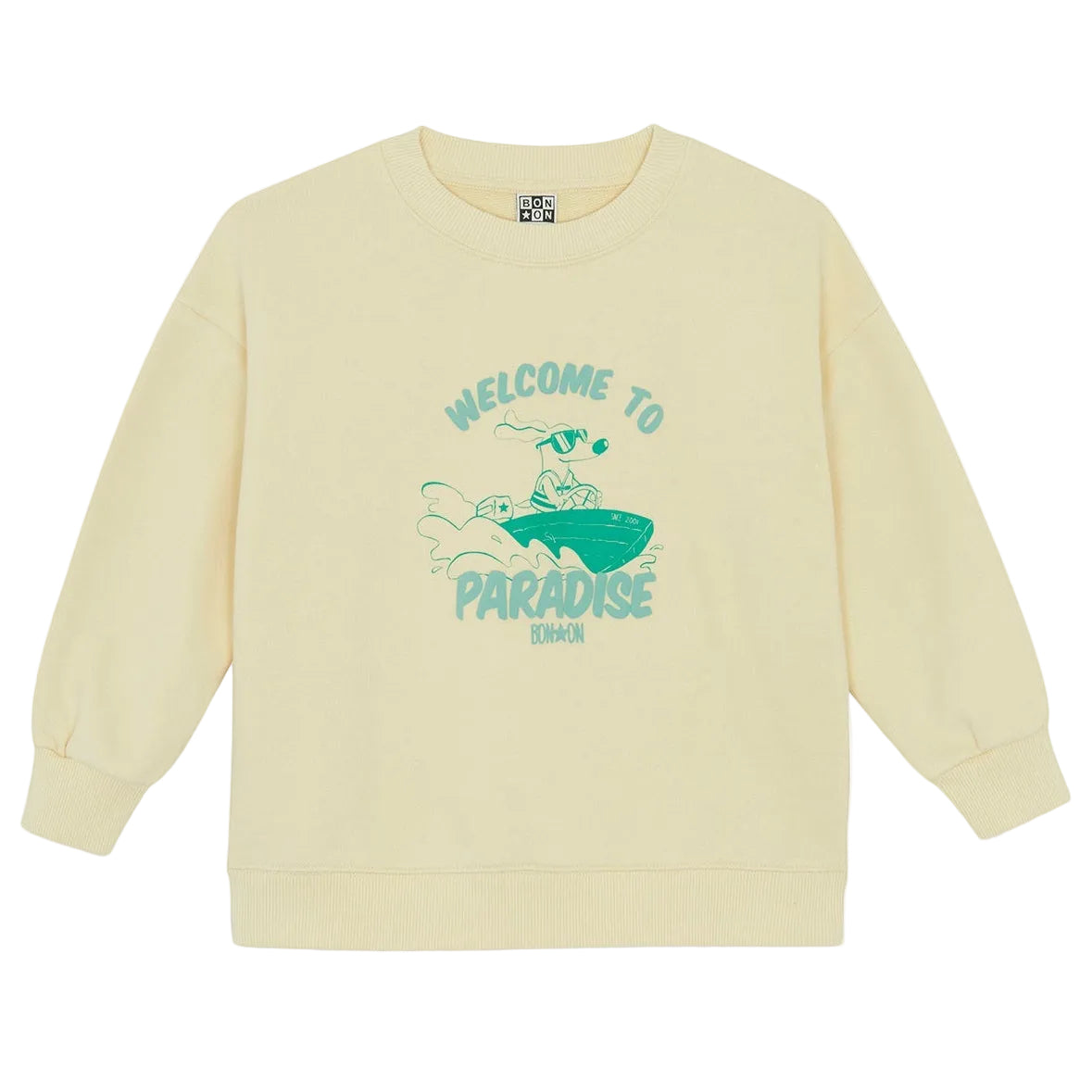 Beige Bonton Boys' Paradise Sweatshirt with ribbed cuffs and green surfing graphic. Features "WELCOME TO PARADISE" and "BONMOM" text. Soft cotton for comfort—meet the Sweatshirt Vanilla Paradise.