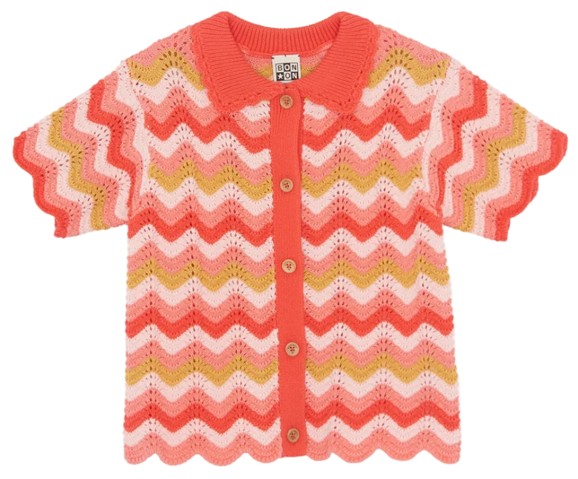 The Girls' Ninon Knit Top by Bonton features short sleeves, zigzag stripes in red, pink, yellow, and white, button-up front, scalloped edges, handmade finishes, and is crafted from 100% cotton for softness and breathability.