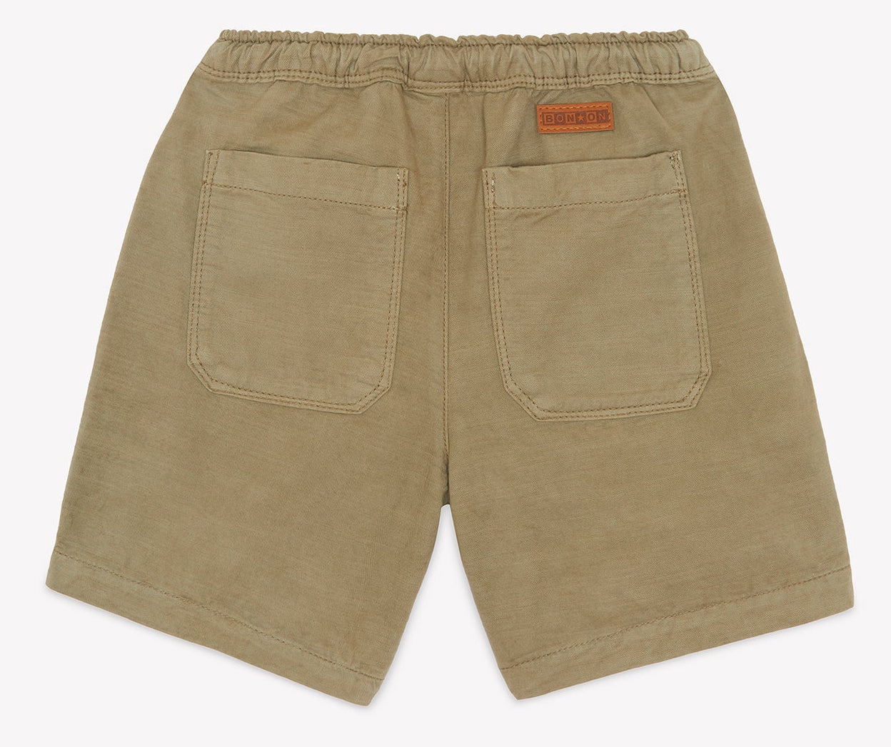 Bonton Boys’ Lyon Short shown from the back, featuring two square pockets and an elastic waistband with a small brown label above the right pocket—introducing this comfortable and stylish cotton design.