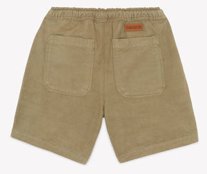 Bonton Boys’ Lyon Short shown from the back, featuring two square pockets and an elastic waistband with a small brown label above the right pocket—introducing this comfortable and stylish cotton design.