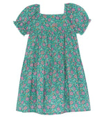 The Bonton Girls' Georgette Dress is a short-sleeve summer dress for children with a green base, pink floral pattern, square neckline, and gathered waist.