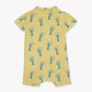 The Baby Boys’ Lilo Onesie by Bonton is a yellow short-sleeve romper, adorned with a playful repeating pattern of blue palm trees for a tropical look. Shown laid flat from the back, this onesie is made from soft cotton to keep your little one comfortable all day.