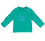 The Bonton Baby Rashguard is a green long-sleeve kids’ shirt with a round neck and front palm tree graphic—ideal as beachwear or a swim t-shirt for fun, sun-filled days.
