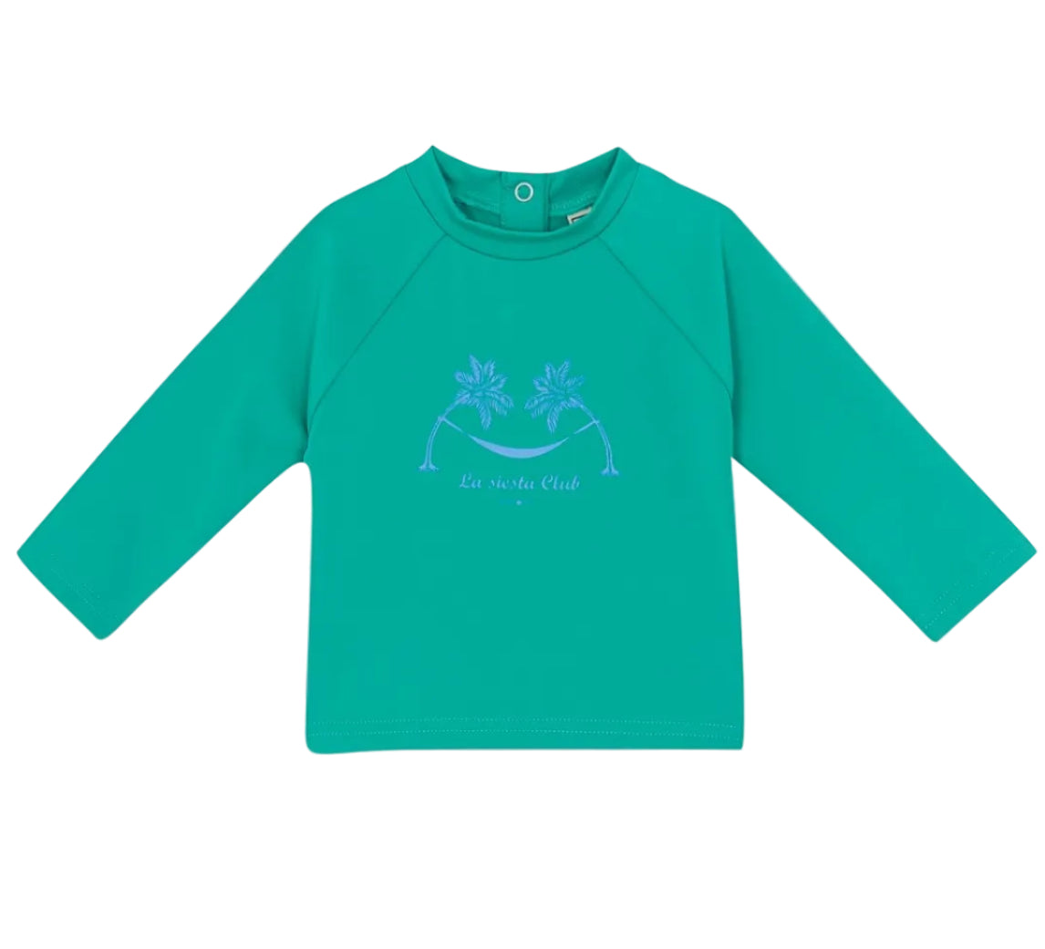 The Bonton Baby Rashguard is a green long-sleeve kids’ shirt with a round neck and front palm tree graphic—ideal as beachwear or a swim t-shirt for fun, sun-filled days.