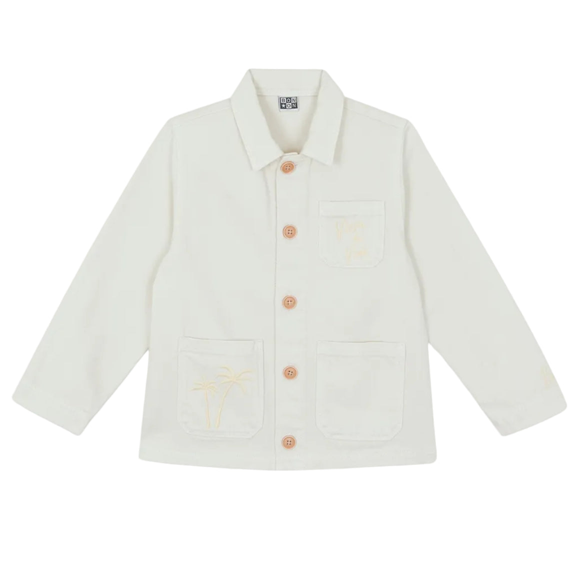 The Girls' Ermana Jacket by Bonton is a white, cotton workwear-style button-up with long sleeves, three front pockets, and subtle palm tree embroidery on two of the pockets.