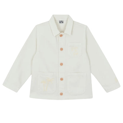 The Girls' Ermana Jacket by Bonton is a white, cotton workwear-style button-up with long sleeves, three front pockets, and subtle palm tree embroidery on two of the pockets.