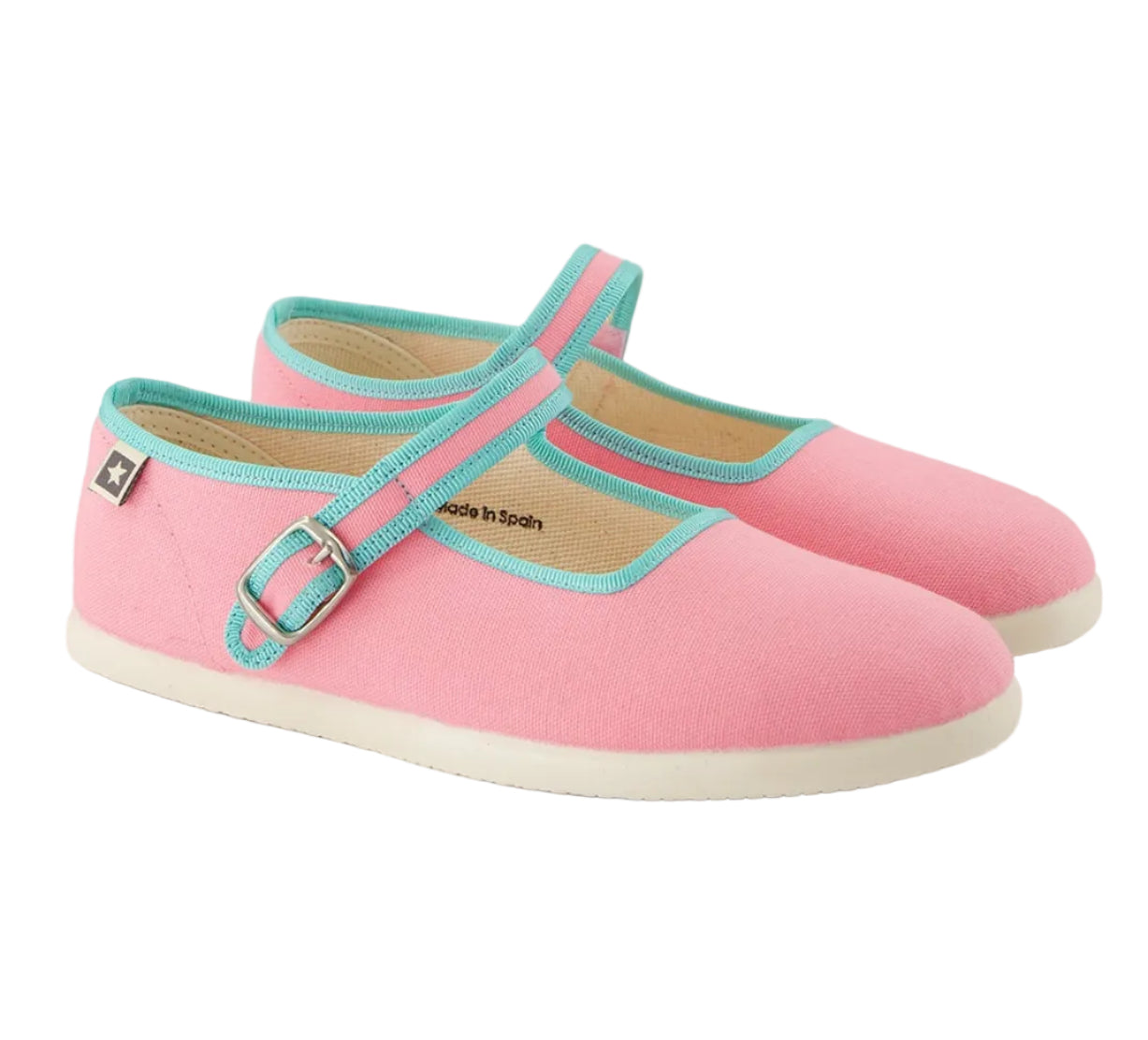 Introducing the Girls’ Jane Slippers by Bonton—pink Mary Jane-style shoes with turquoise trim, white soles, a buckle strap, and a small star tag on the side. These slippers offer everyday comfort and are perfect for kids to relax in.