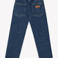 Back view of the Boys’ Fracas Pant by Bonton in mid-wash blue denim, featuring a comfortable elastic waist, two back pockets, and a small tan Bonton brand label for a casual look.