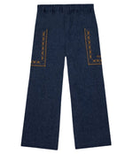 The Girls’ Lauren Pant by Bonton features wide-leg chambray cotton, an elastic waistband, and geometric brown embroidery on both back pockets. Displayed flat on a white background, these stylish girls’ pants offer a chic and comfortable option for any wardrobe.
