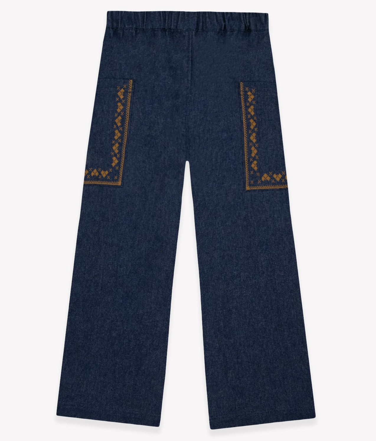 The Girls’ Lauren Pant by Bonton features dark blue, wide-leg trousers crafted from soft chambray cotton with an elastic waistband and two large front pockets detailed in a brown geometric pattern—offering both comfort and style.