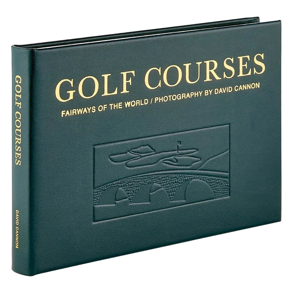 Dark green Graphic Image Golf Courses: Fairways of the World hardcover book with an embossed illustration of a stone bridge and green on the cover.