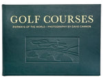 Dark green, landscape-oriented Golf Courses: Fairways of the World book featuring David Cannon’s photography, with gold text and an embossed illustration of a stone bridge and green.