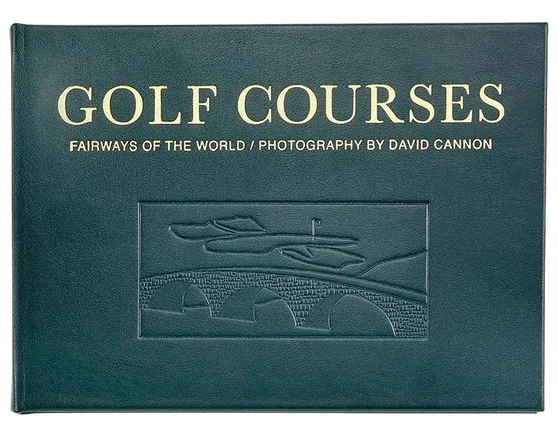 Dark green, landscape-oriented Golf Courses: Fairways of the World book featuring David Cannon’s photography, with gold text and an embossed illustration of a stone bridge and green.