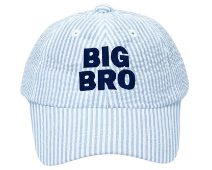 The Bits & Bows Big Bro Baseball Hat features light blue and white stripes with "BIG BRO" embroidered in navy on the front, combining coastal charm and sun-ready sportswear.