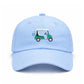 Introducing the Golf Cart Hat from Bits & Bows: a light blue baseball cap adorned with an embroidered green and yellow golf cart and golf clubs on the front—an ideal stylish accessory for any golf enthusiast and a standout fairway fashion statement.