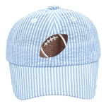 Add a sporty touch to your look with the Bits & Bows Blue Seersucker Football Baseball Hat, featuring light blue and white stripes and an embroidered brown football on the front.