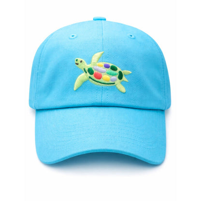 The Bits & Bows Turtle Hat is a bright blue baseball cap featuring an embroidered sea turtle with a multicolored shell, displayed against a plain white background.
