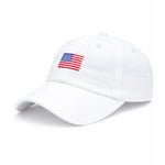 White baseball cap by Bits & Bows featuring a small embroidered American flag on the front, displayed against a plain white background. The American Flag Baseball Hat combines classic heritage style with everyday versatility, making it an ideal accessory for any outfit.