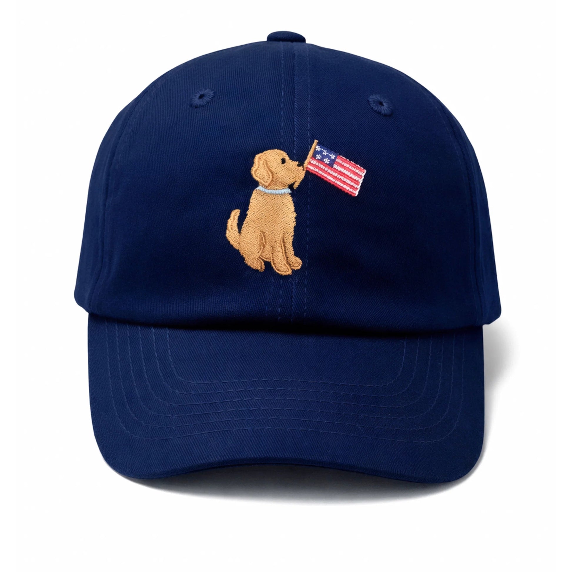 Show off your patriotic spirit with the Bits & Bows Patriotic Dog Baseball Hat—a navy blue hat for dogs featuring an embroidered design of a lovable pup holding an American flag in its mouth on the front.