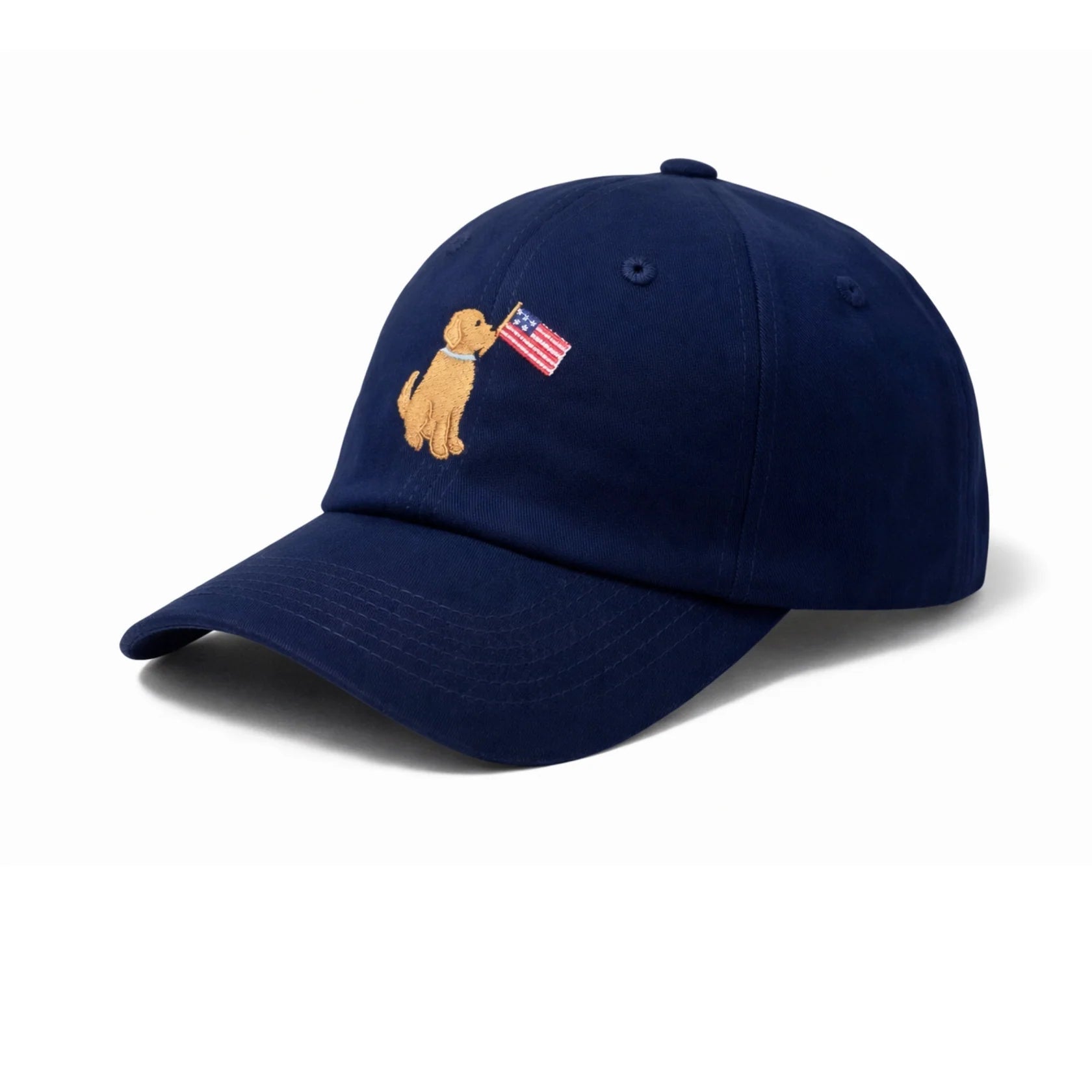 Show your patriotic style with the Bits & Bows Patriotic Dog Baseball Hat, a navy blue cap featuring an embroidered dog holding an American flag on the front. This charming hat is perfect for dog lovers and anyone who wants to showcase their American spirit.